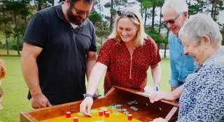 Guests solving handmade puzzles at Elude Escape Rooms