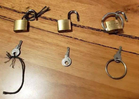 Padlocks laid out on a wooden floor