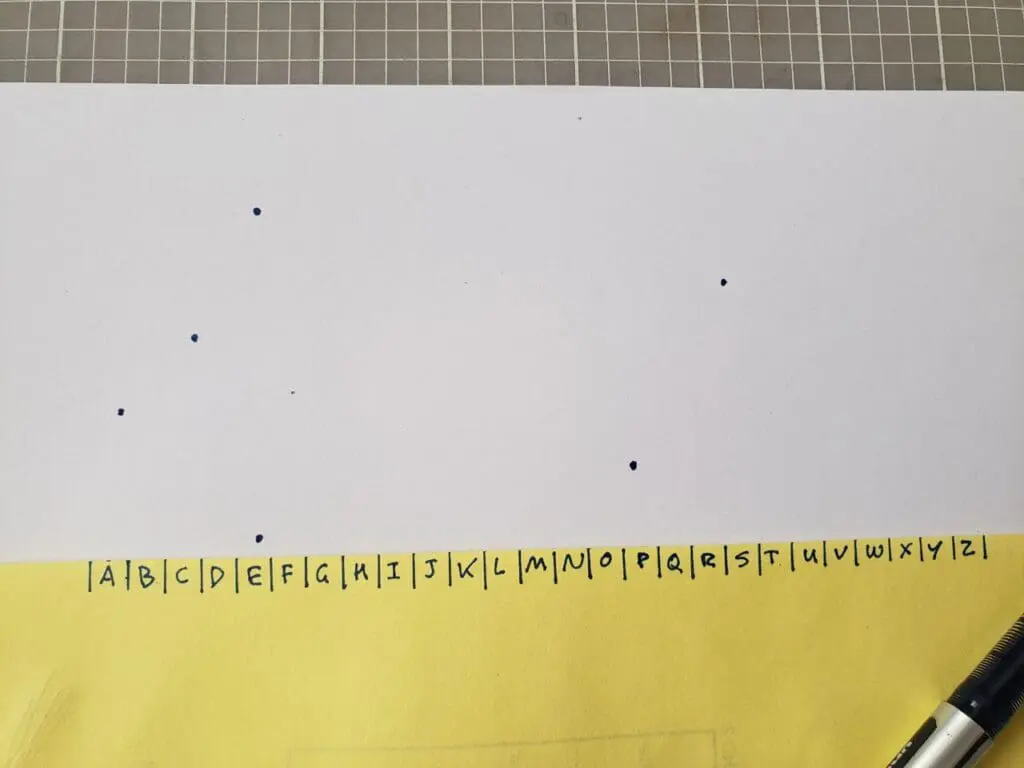Paper strip with dots marking letters