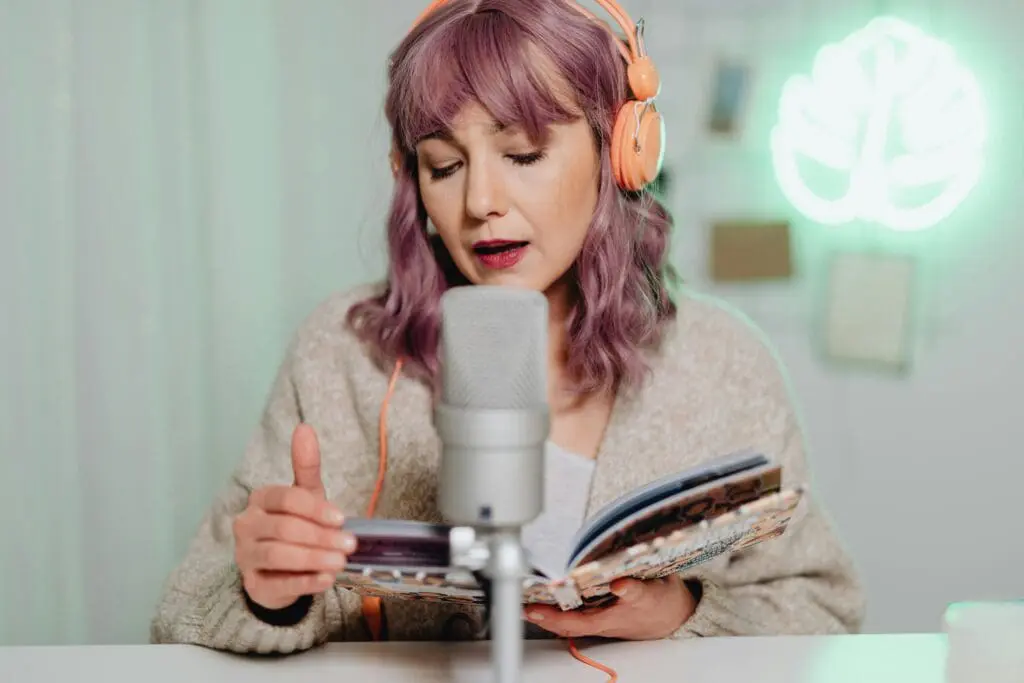 Woman speaking into a studio microphone