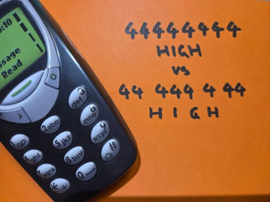 Old mobile phone with the keypad code for HIGH, without and with spaces